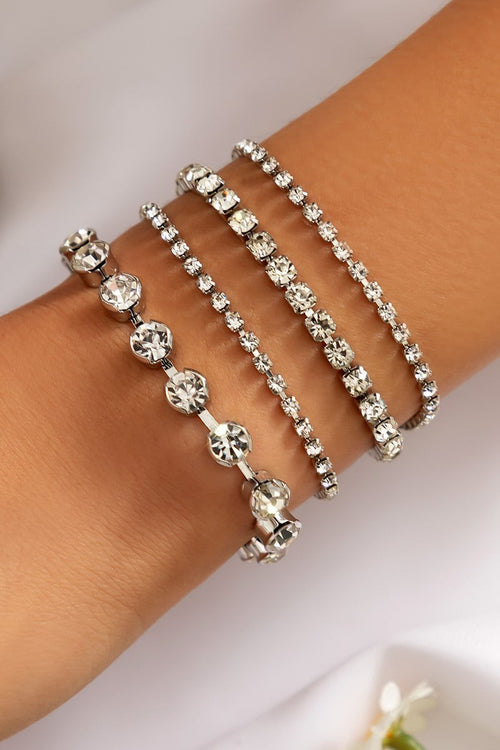 Set of four white rhinestone bracelets